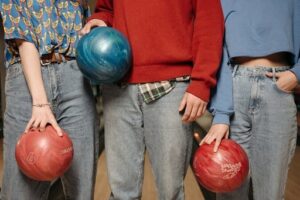 bowlers holding urethane bowling ball