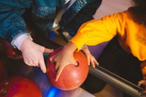 learning to hold a bowling ball