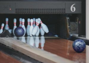 bowling pins with balls