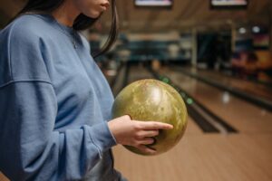 girl holding a bowling ball