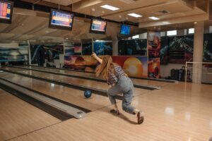 girl playing bowling