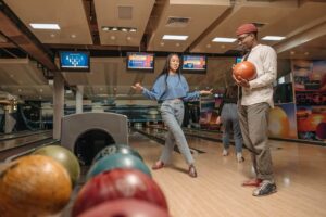 man and women is playing bowling