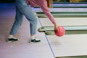 women playing bowling