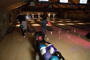 young people in bowling alley